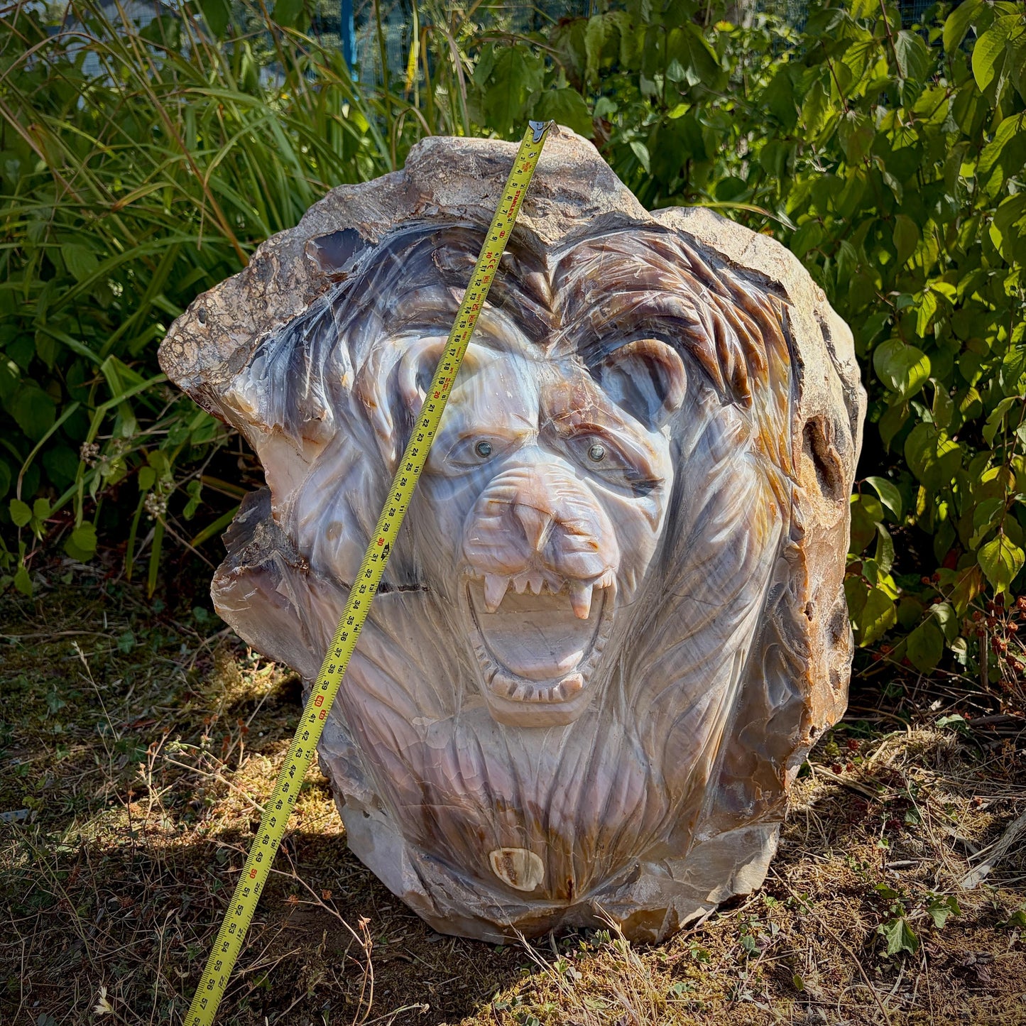Genuine Violet Agate crystal lion sculpture with rich natural colour variations.