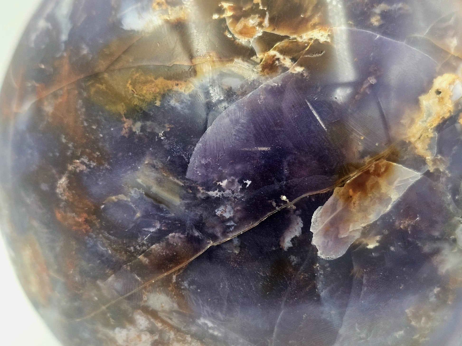violet agate crystal ball with unique veils and inclusions for collectors and enthusiasts