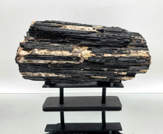 XL black tourmaline crystal with mica front view
