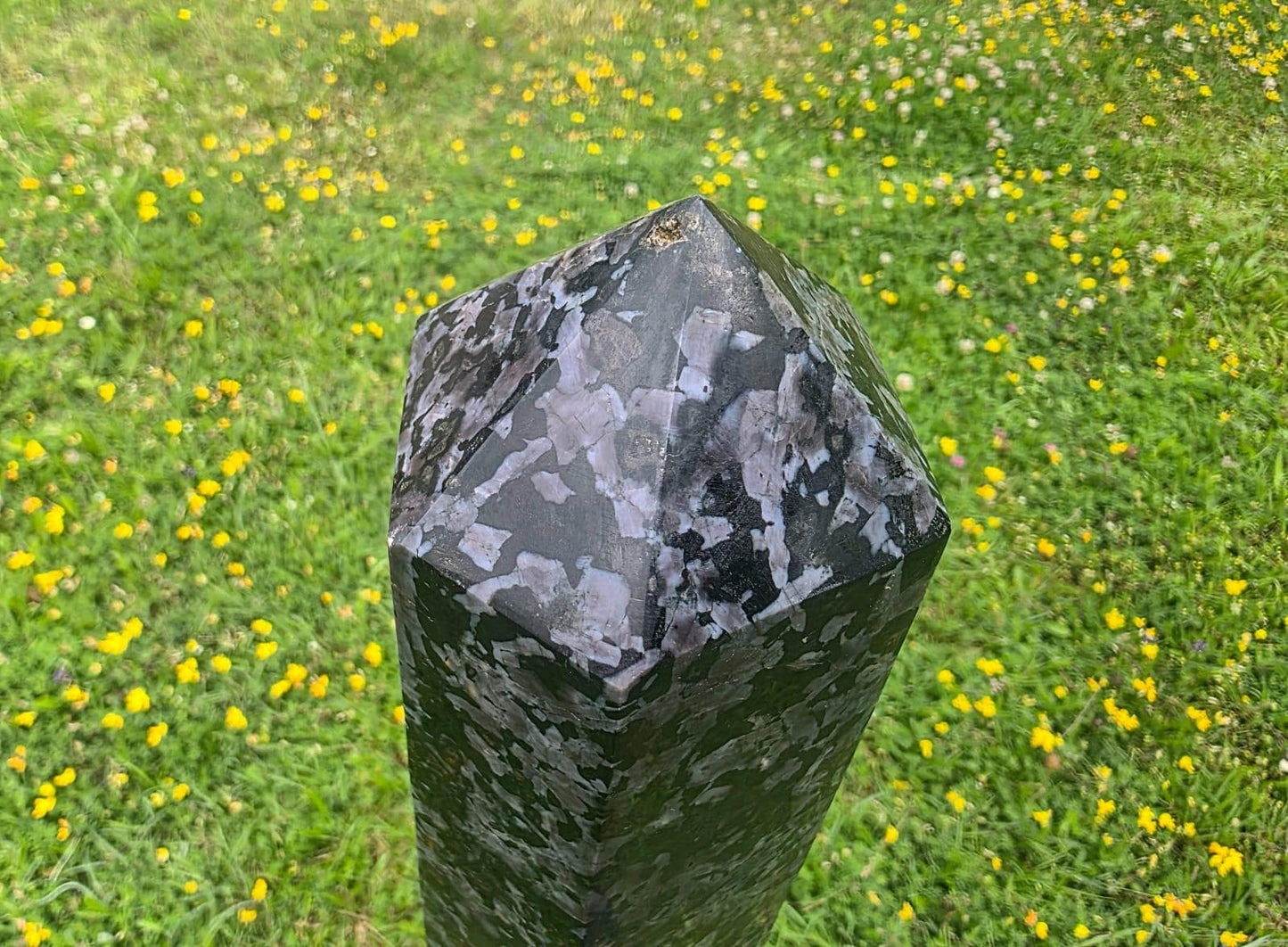 XL Indigo Gabbro tower styled as a luxury interior crystal sculpture with polished charcoal and indigo tones.