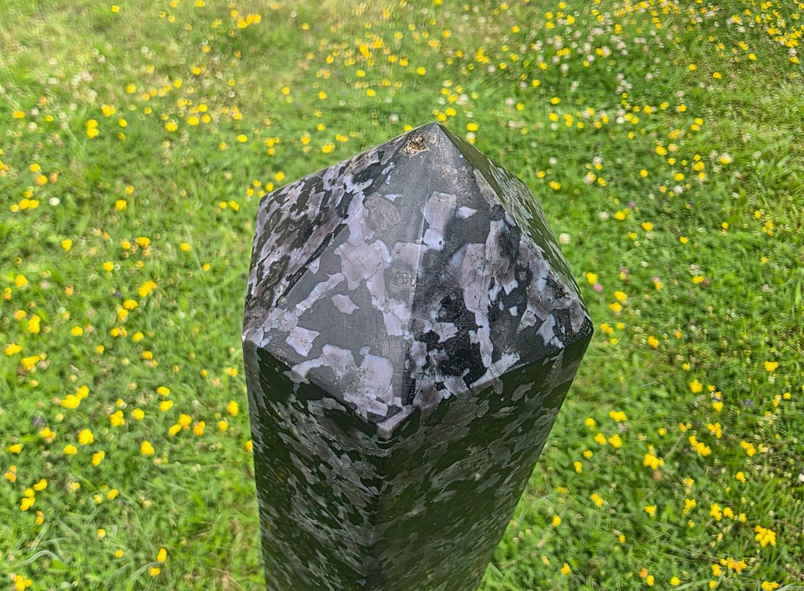 XL Indigo Gabbro tower styled as a luxury interior crystal sculpture with polished charcoal and indigo tones.