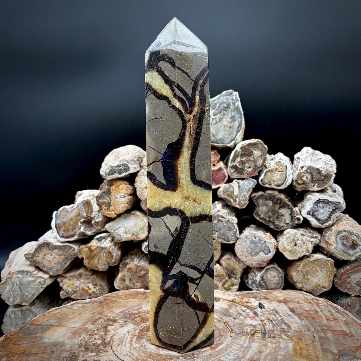 Yellow Septarian prism displayed as natural stone sculpture